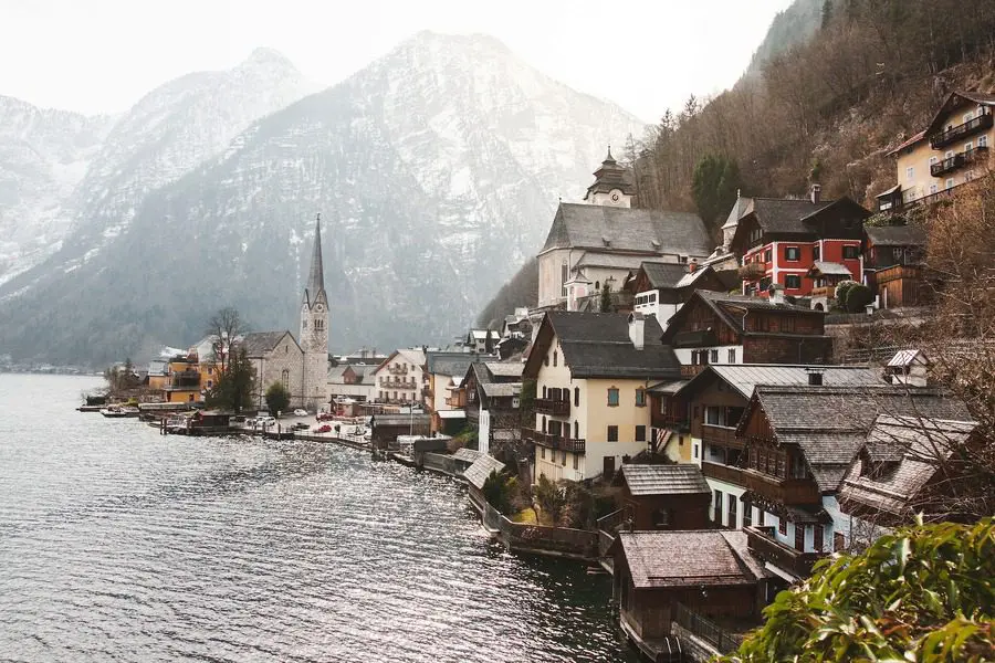 A view of a town with mountains in the background.