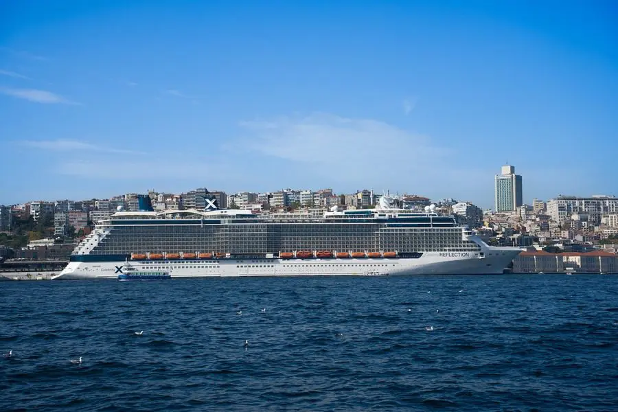 A large cruise ship is in the water.