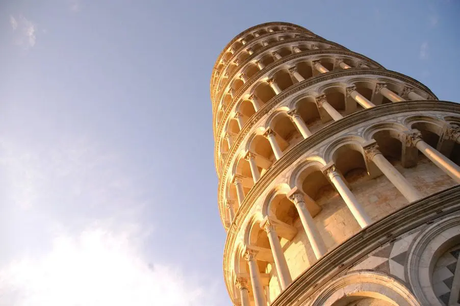 A tall tower with many arches and columns.