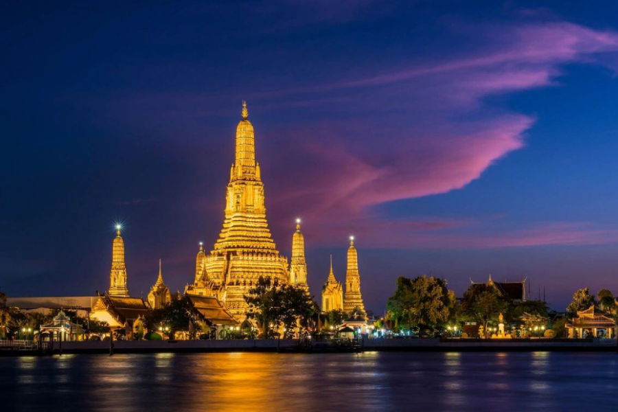 A view of the river and the temple at night.