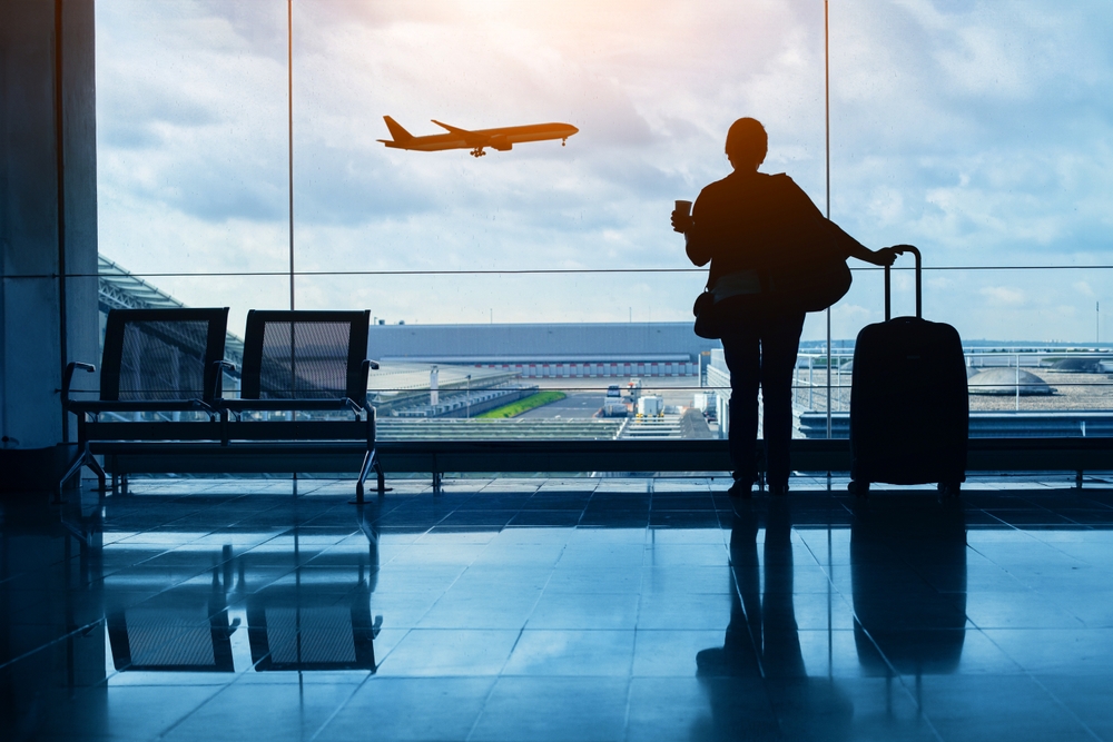Travel,by,plane,,woman,passenger,waiting,in,airport,,silhouette,of