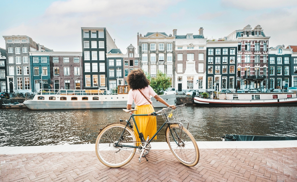 Happy,female,tourist,visiting,amsterdam,city,,netherlands, ,delightful,woman